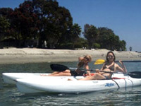 Katie (left) and her friend enjoying an afternoon of kayaking on Mission Bay.